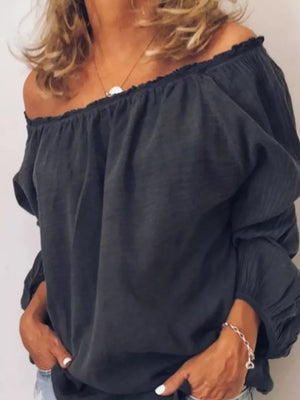 Gray off-the-shoulder maternity shirt with gathered neckline and frill detail.