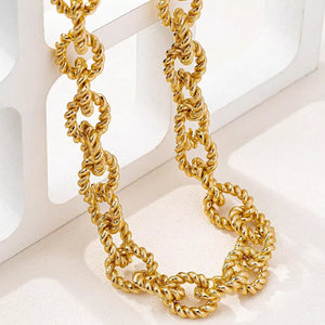 gold necklace with choker length and clasp
