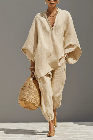 Chic relaxed beige linen two-piece set with V-neck tunic and drawstring pants.