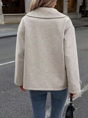 Light gray wool blend double-breasted pea coat with a wide collar.