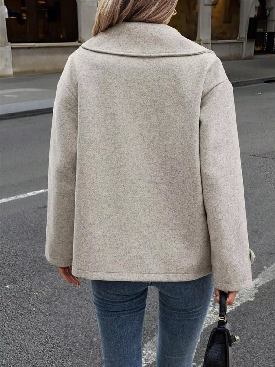 Light gray wool blend double-breasted pea coat with a wide collar.