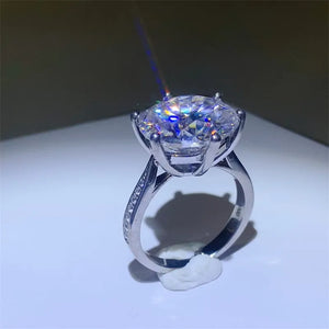 Prismatic Halo Silver Engagement Ring with a large, brilliant-cut center stone and pavé band.