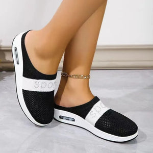 Black mesh slip-on sneakers with white sport detail and air cushion sole