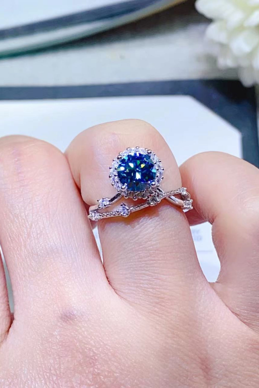 Sky blue moissanite halo engagement ring set with diamond band
