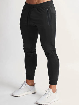 Black slim fit tech joggers with zip pocket and drawstring waist.