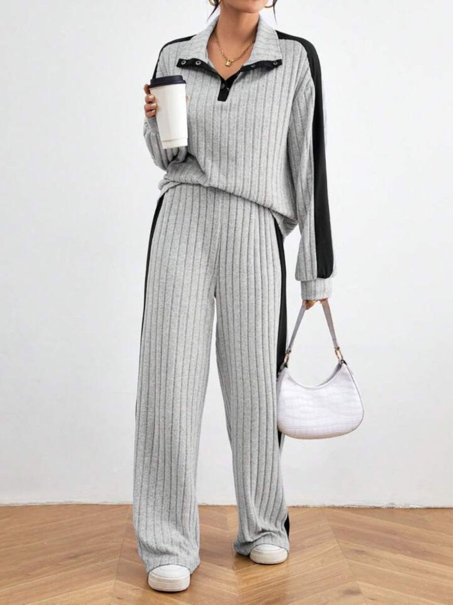 Light gray ribbed polo lounge set with contrast trim and snap button detail.