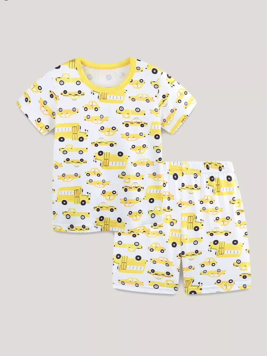 Toddler pajama set with yellow cartoon cars print on white, featuring bright yellow trim.