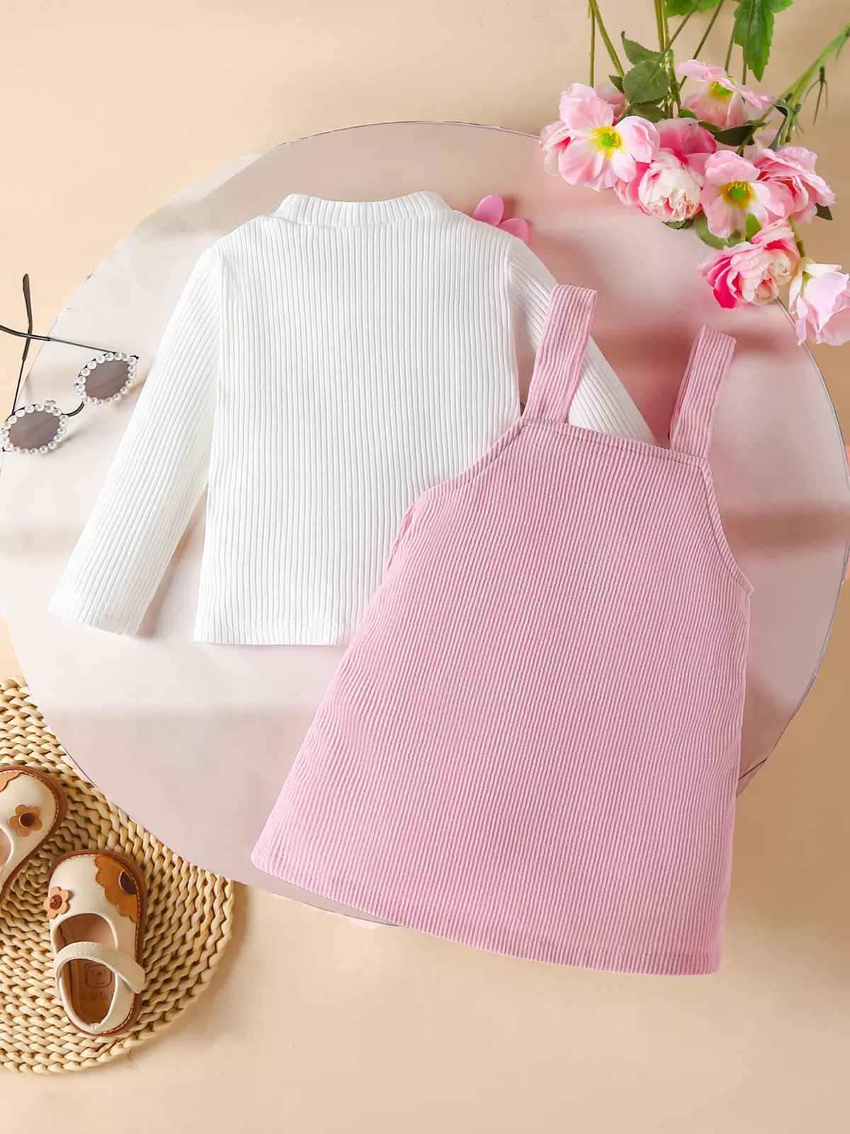 Baby corduroy dress set in blush pink with white ribbed long sleeve top.