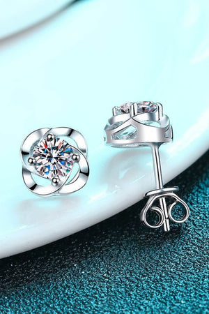 Silver four-leaf clover stud earrings with sparkling central stones