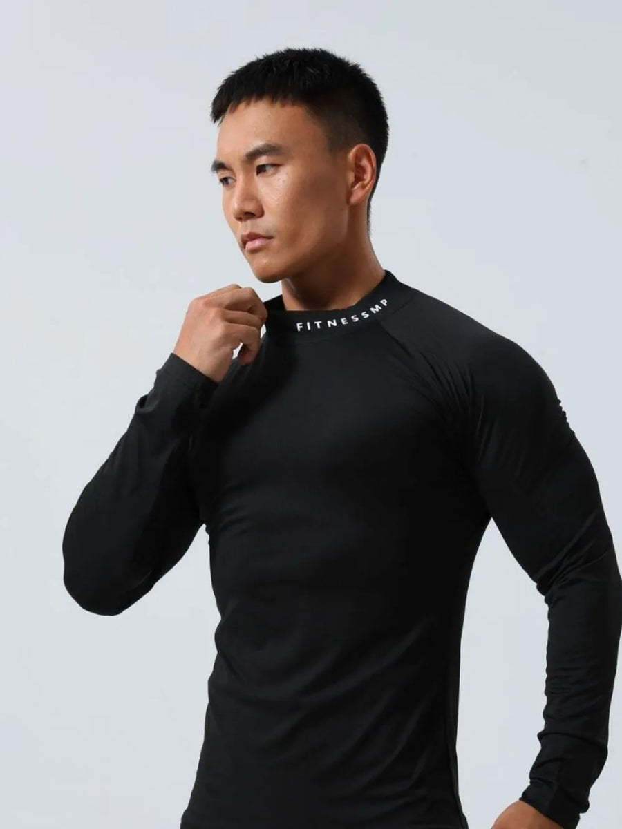 Black long sleeve mock neck compression activewear top with white logo detail