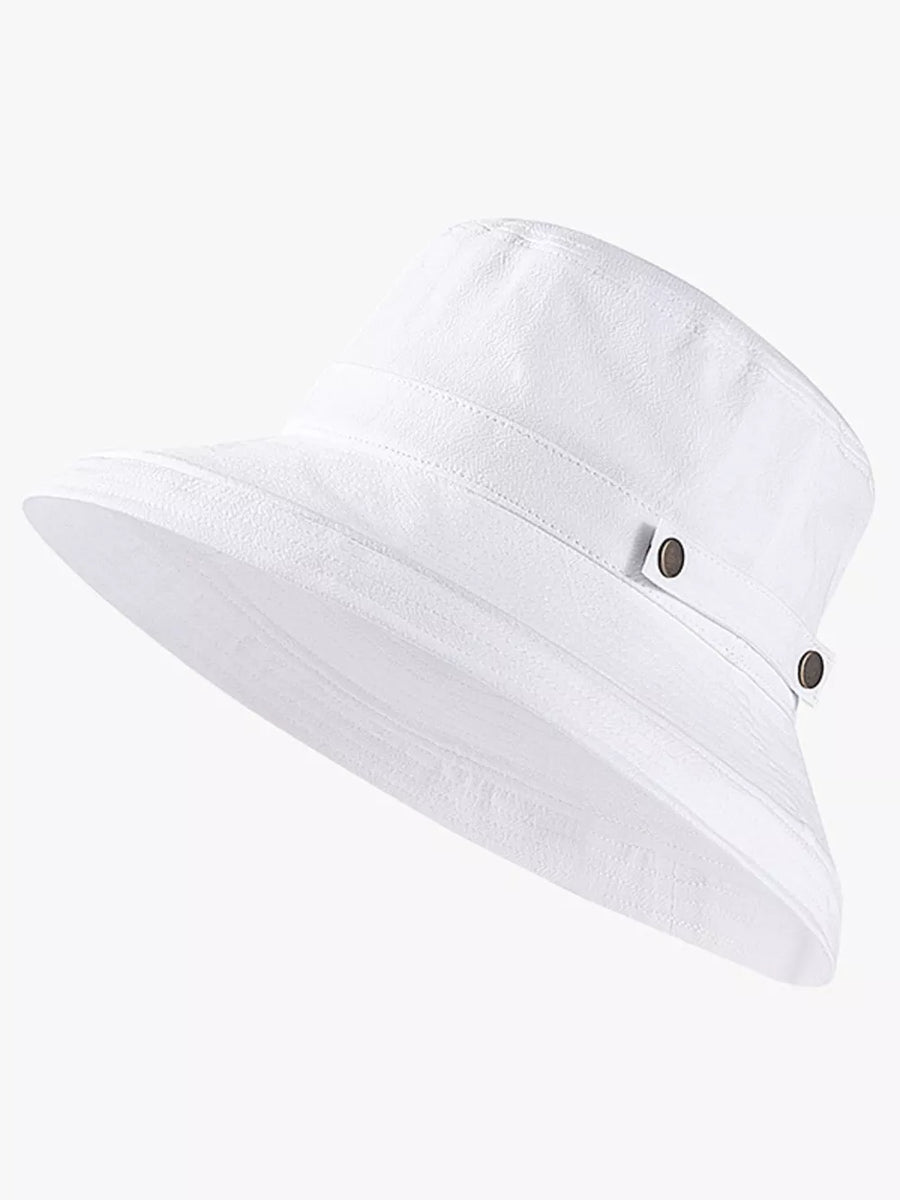 White cotton bucket hat with wide brim and brass hardware detail
