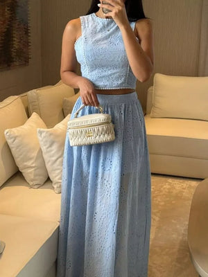 Light blue eyelet cropped top and maxi skirt set with pearl trim.