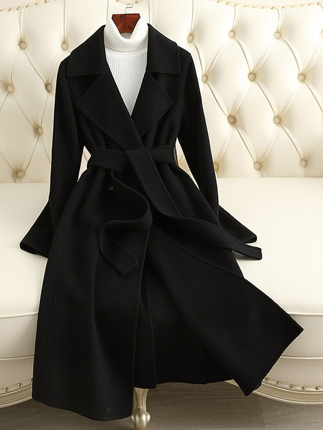 wool coat in black featuring belted and A-line fit