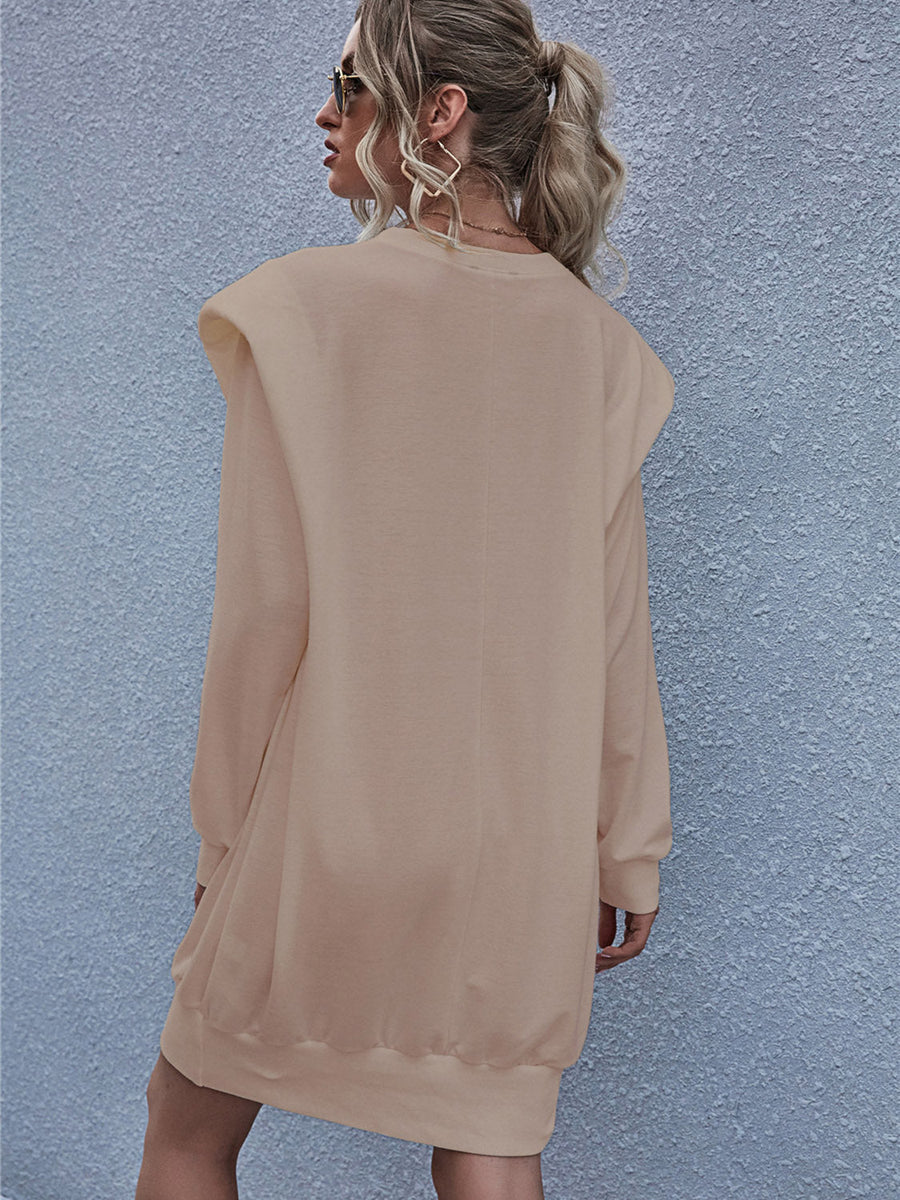 Tan sweatshirt mini dress with padded shoulders and long sleeves.