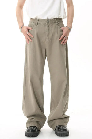 Khaki wide-leg denim pants with a relaxed fit and front pockets.