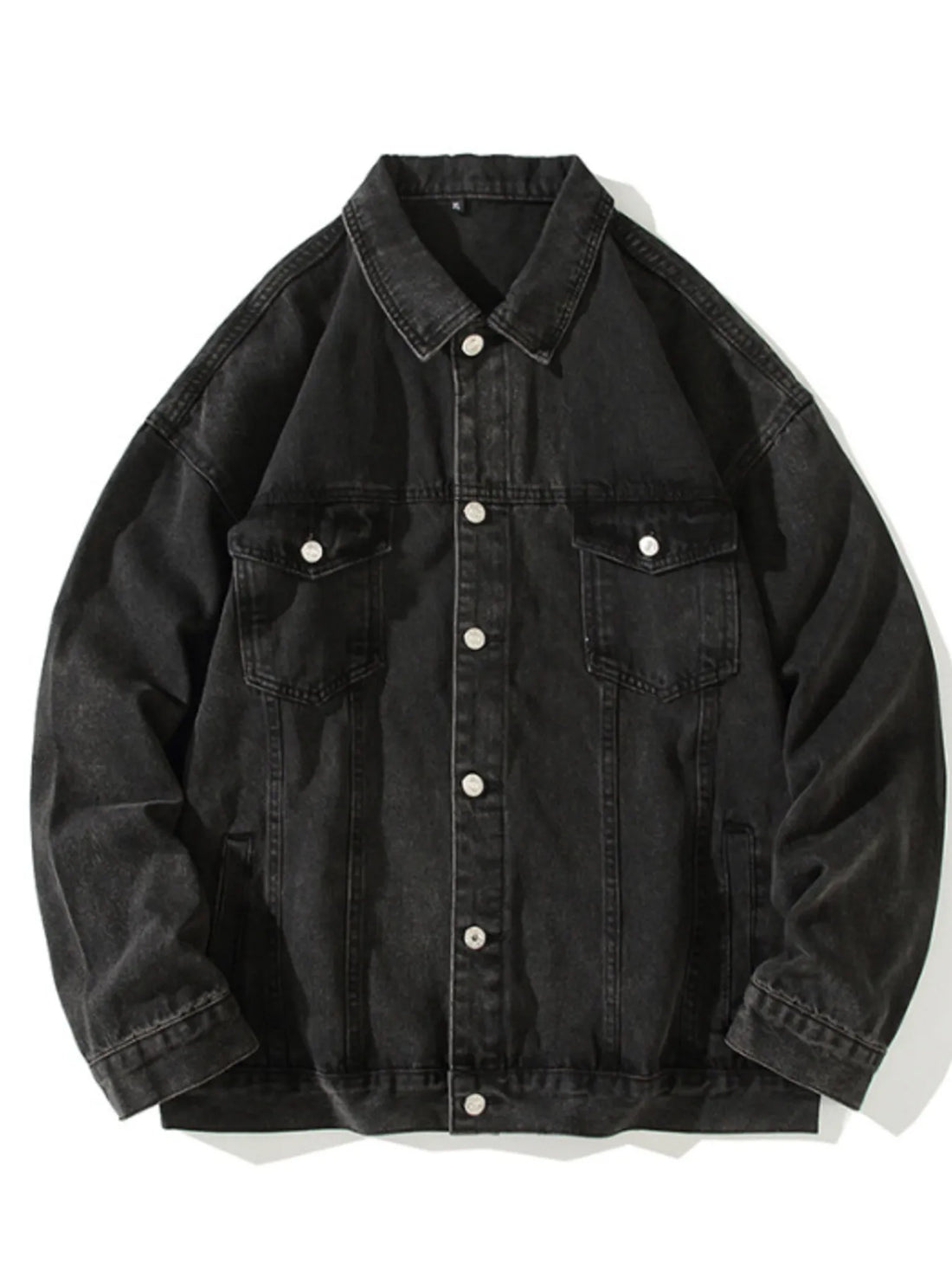 Black 100% cotton denim trucker jacket with button-up front and chest pockets.