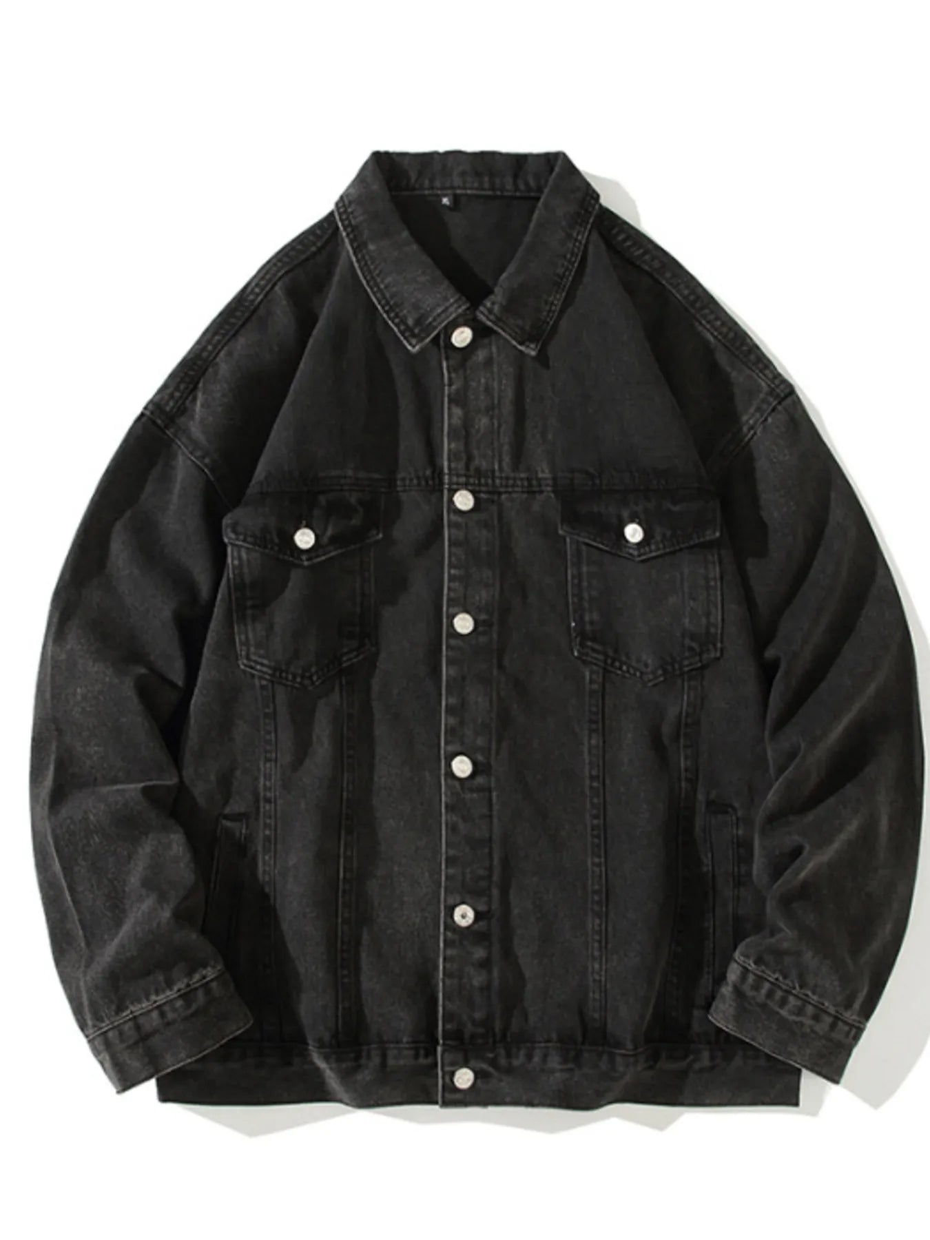 Black 100% cotton denim trucker jacket with button-up front and chest pockets.