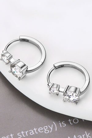 Silver double stone huggie hoop earrings with two clear cubic zirconia stones.