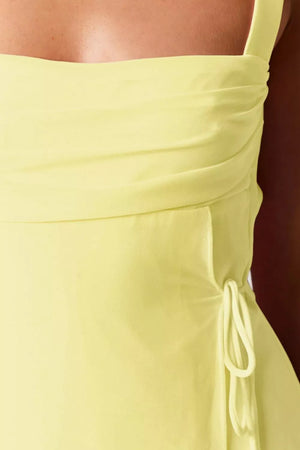 Yellow ruched mini dress with square neckline and side tie detail
