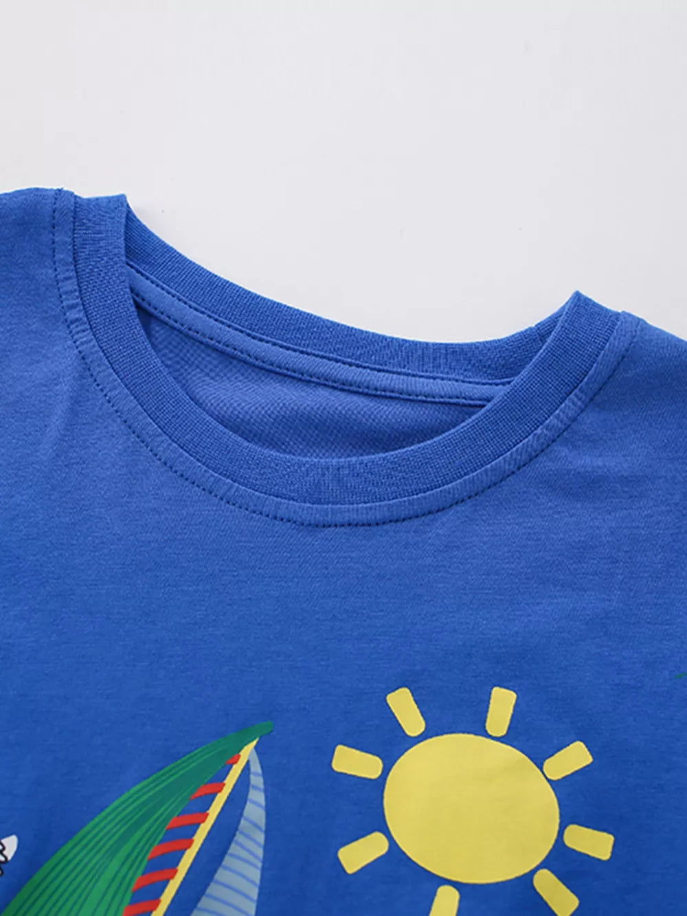 Blue cotton baby tee with nautical graphic and sun detail