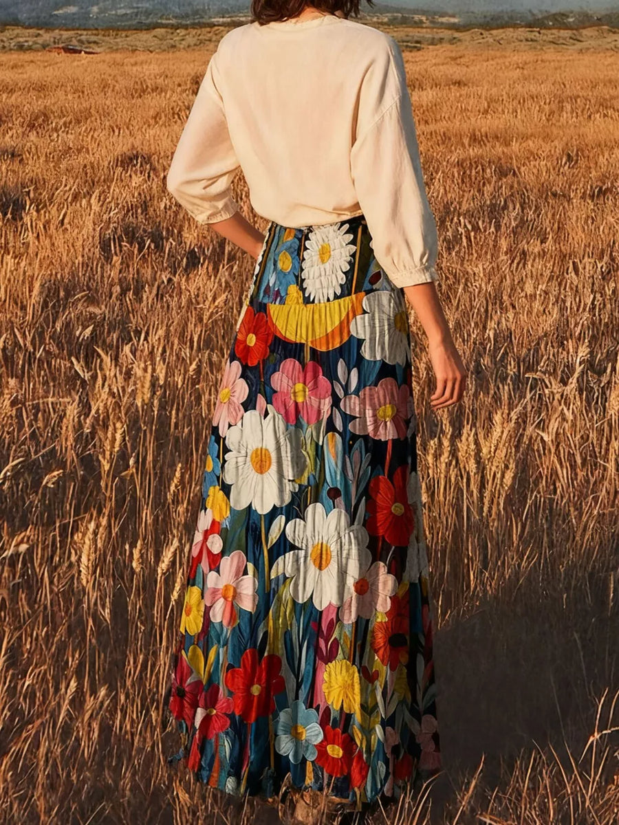 white maxi skirt featuring tiered and floral