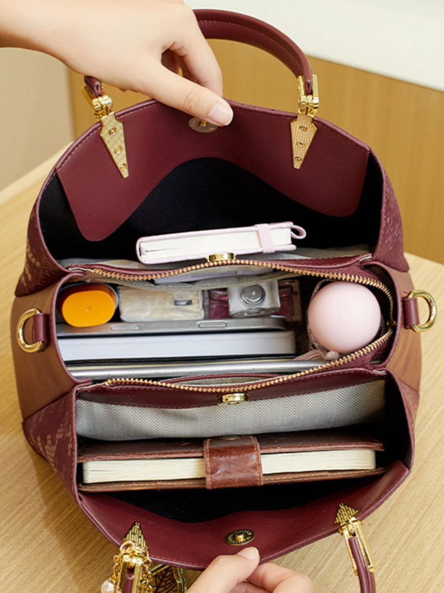 handbag in burgundy with top handles and medium