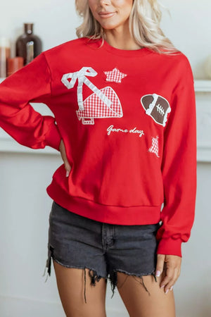 sweatshirt in red featuring gingham patches and relaxed fit