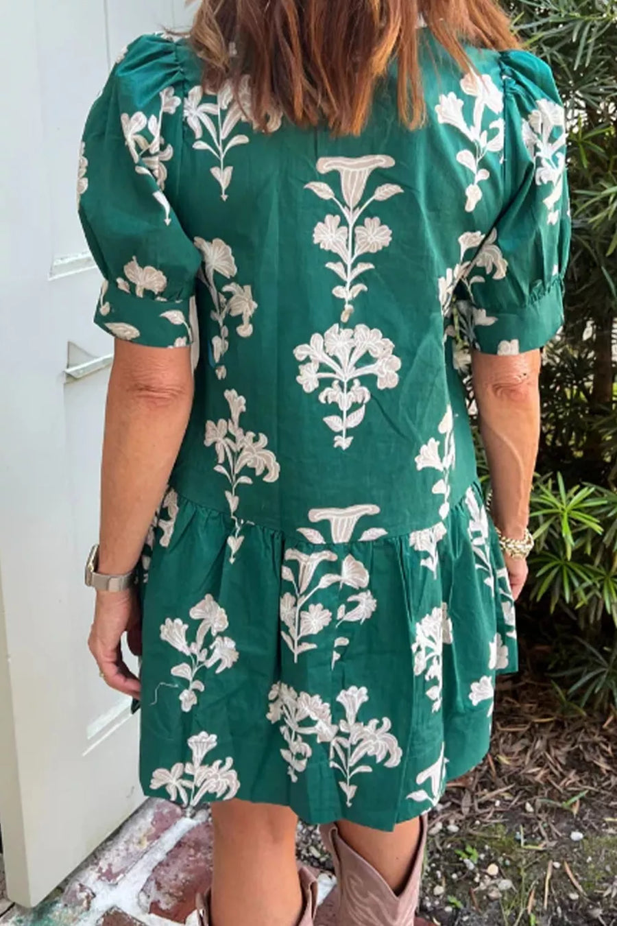 Green floral mini dress with puff sleeves and tiered skirt