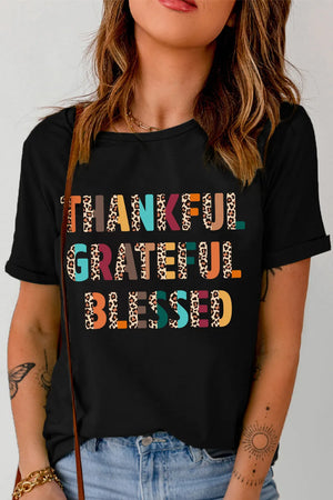 Black graphic tee with leopard print "Thankful Grateful Blessed" text