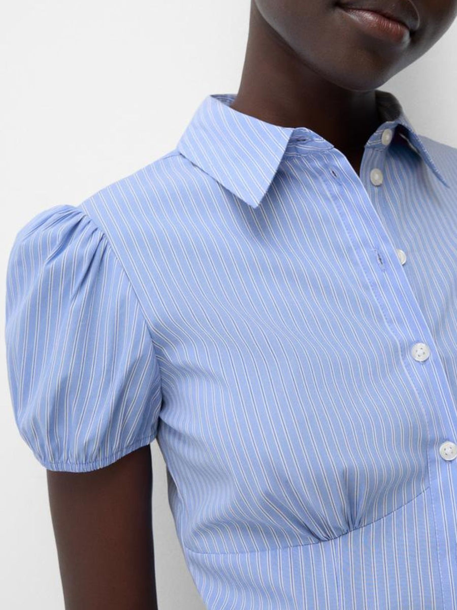 Light blue pinstripe button-up shirt with puff sleeves and a fitted waist.