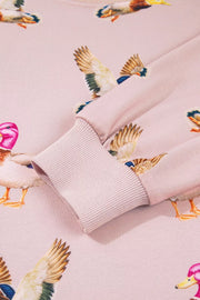 sweatshirt featuring duck-print in Blush Pink with 100% polyester Care instructions: Machine wash cold texture