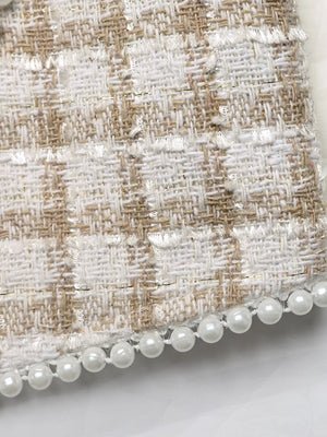 Pearl trim tweed jacket in apricot with a plaid pattern and frayed edges.