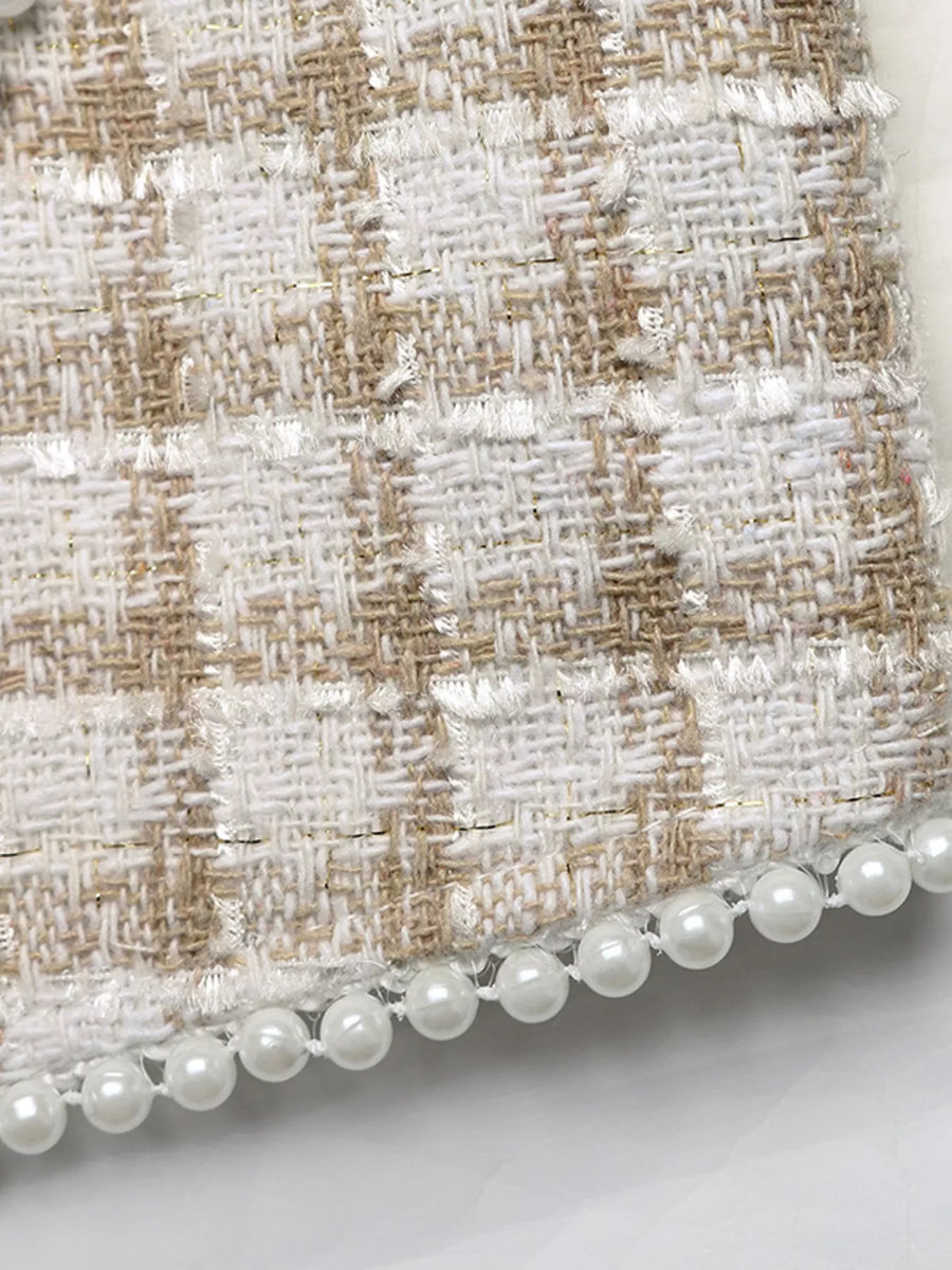 Pearl trim tweed jacket in apricot with a plaid pattern and frayed edges.