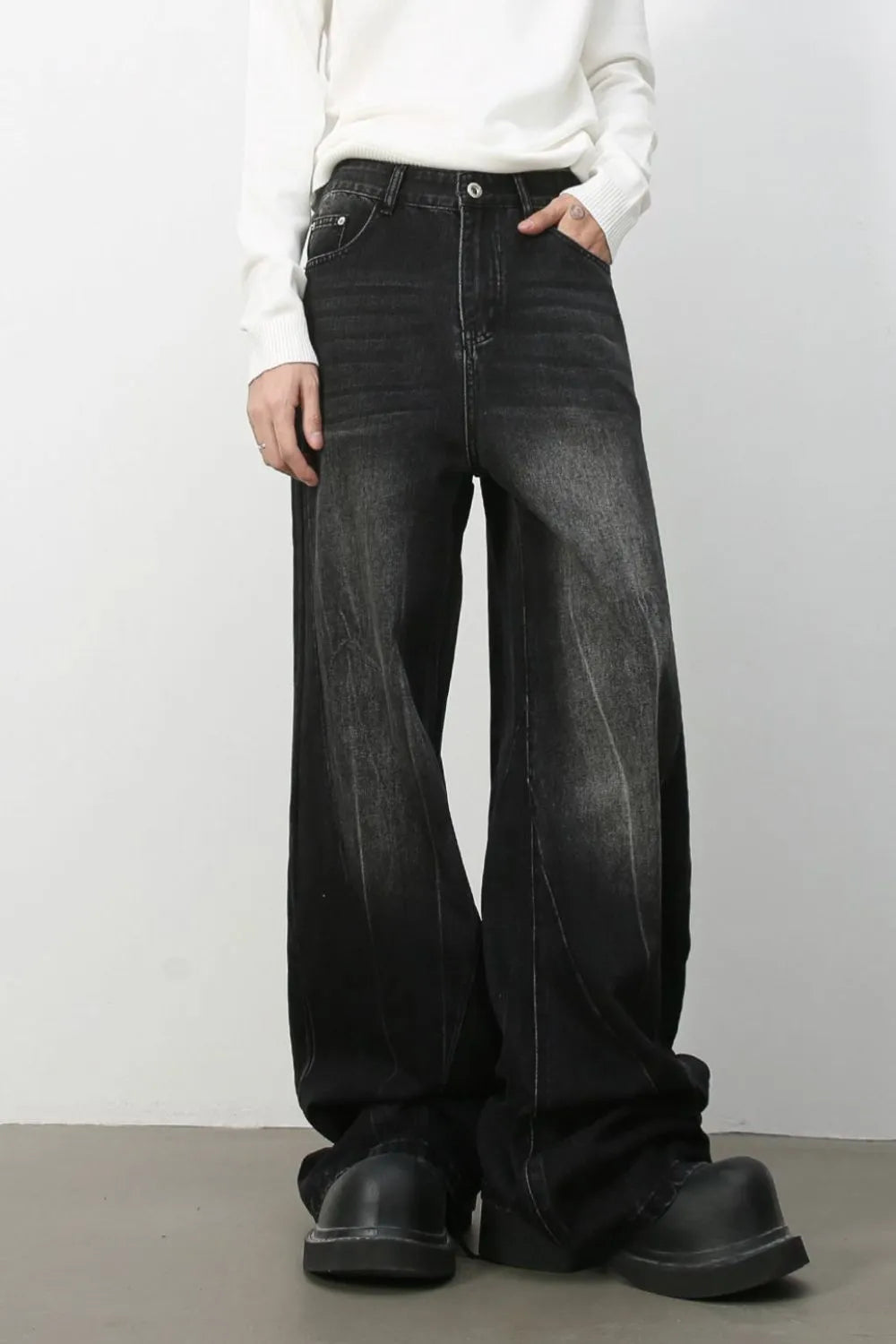 Dark wash effect oversized palazzo jeans with a wide leg and casual styling.