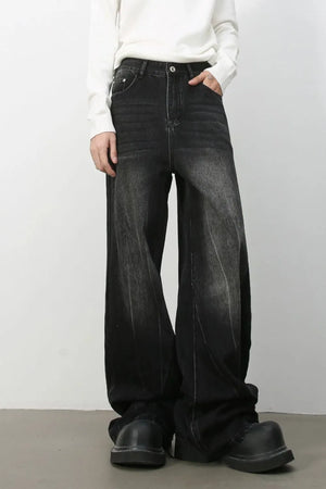 Dark wash effect oversized palazzo jeans with a wide leg and casual styling.