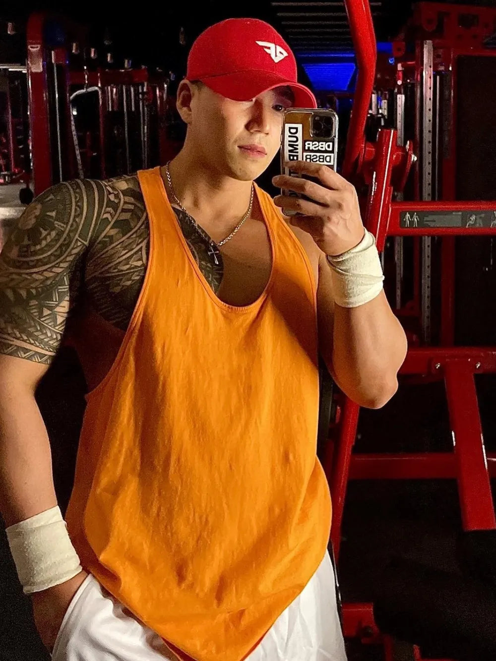 Orange scoop neck workout tank top with a relaxed fit.
