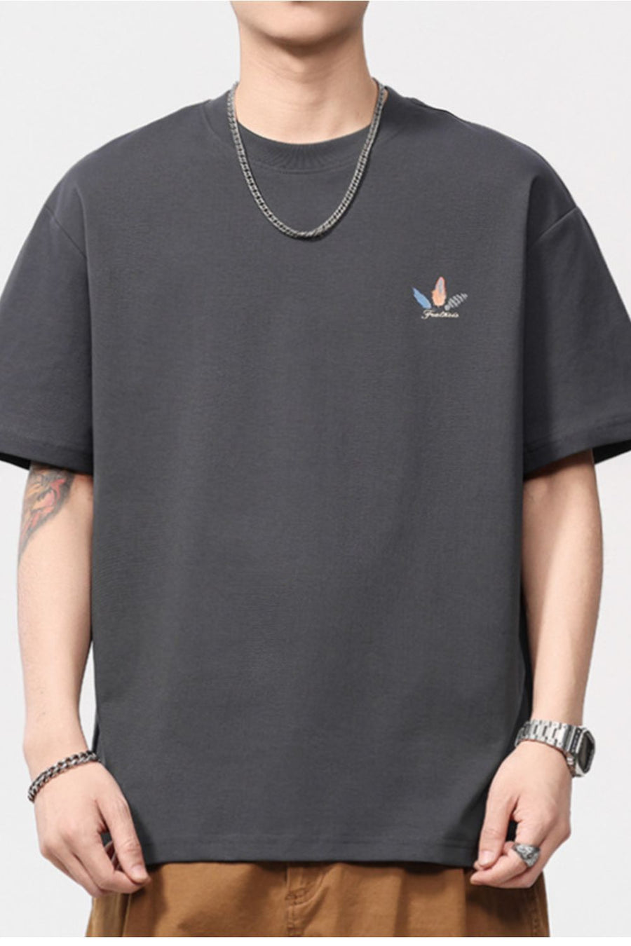 Men's dark gray cotton blend crew neck t-shirt with a small feather print detail.