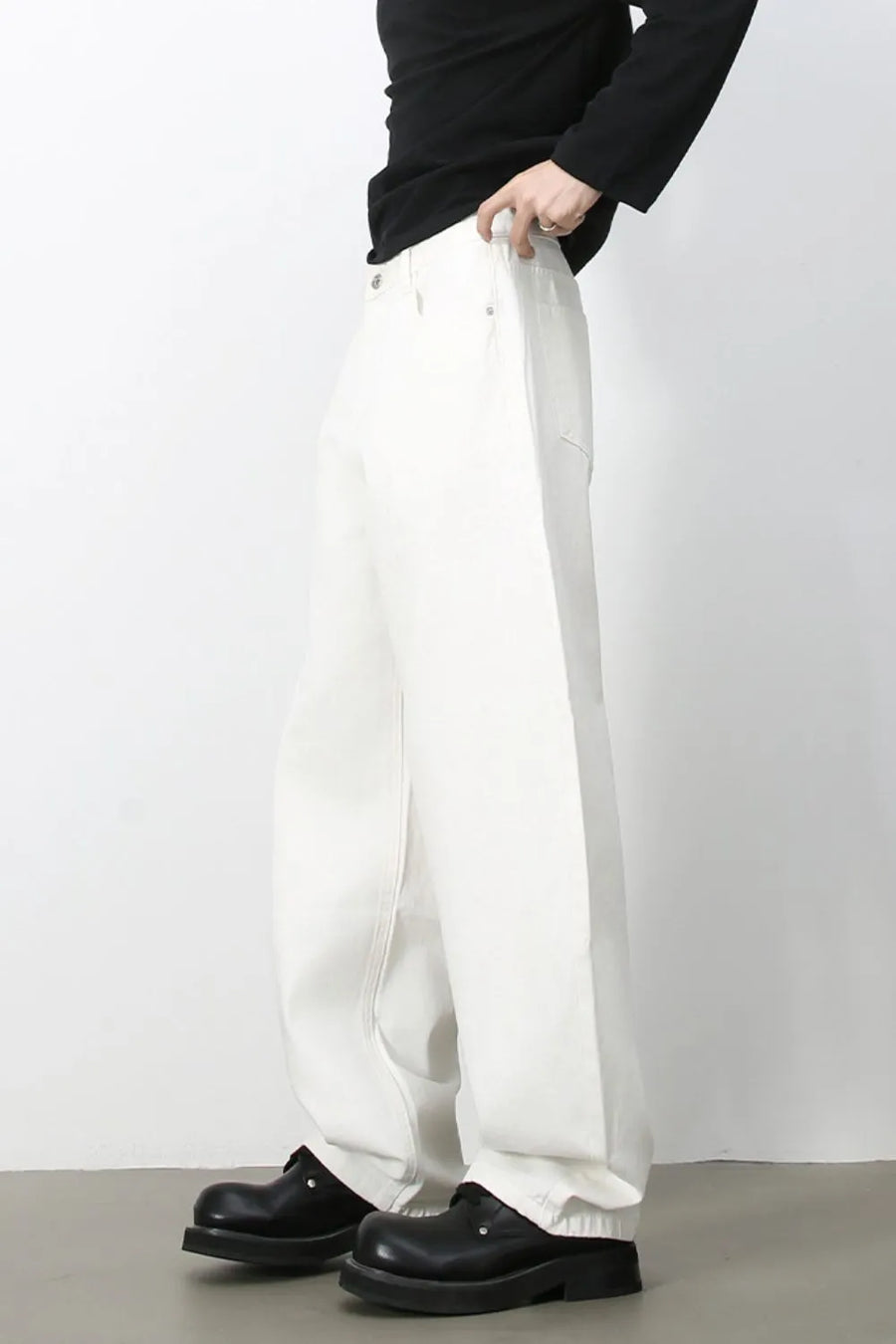 Sculpted ivory denim balloon trousers with a relaxed fit and casual styling.
