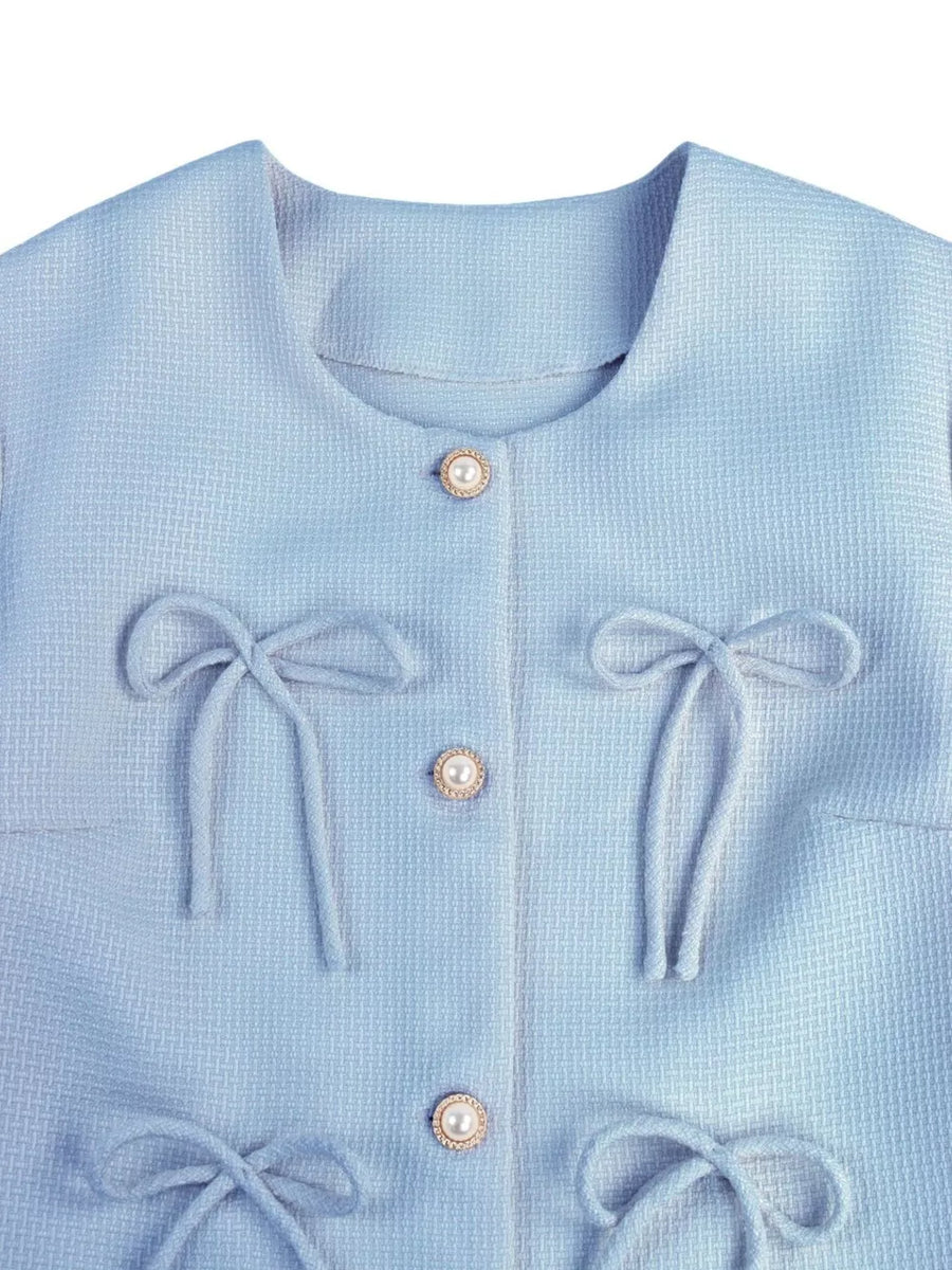 Light blue tweed jacket with pearl buttons and tie details