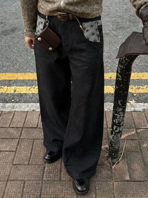 jeans in black featuring pocketed and wide-leg fit