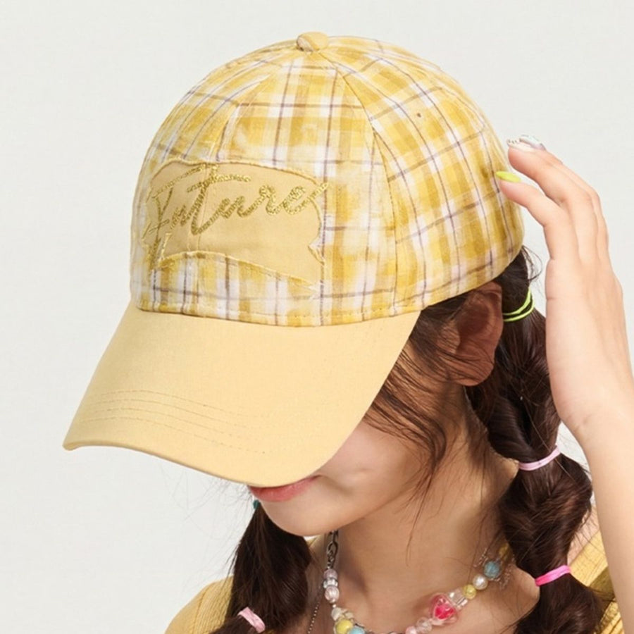 Yellow plaid baseball cap with embroidered detail and solid brim