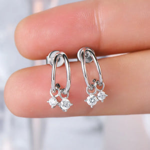 Silver cubic drop hoop earrings with clear cubic zirconia charms.