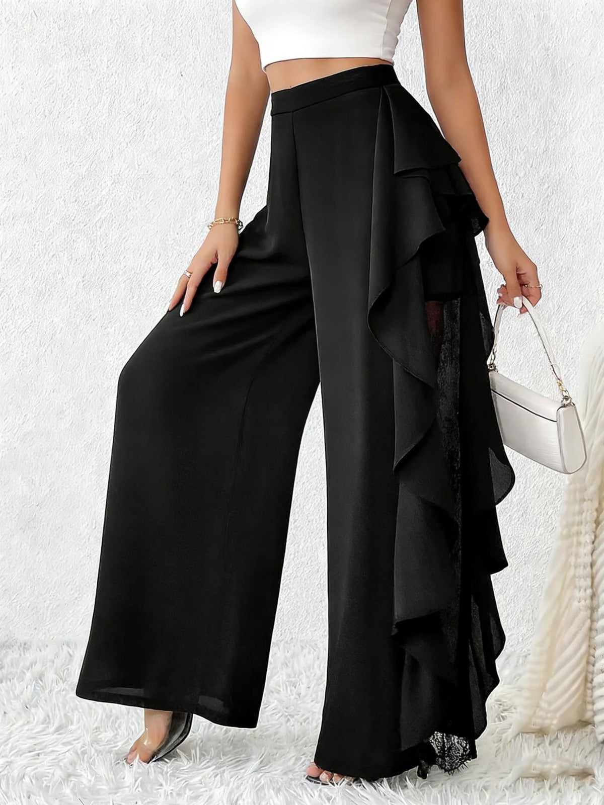 wide-leg pants in black featuring ruffled and flared fit