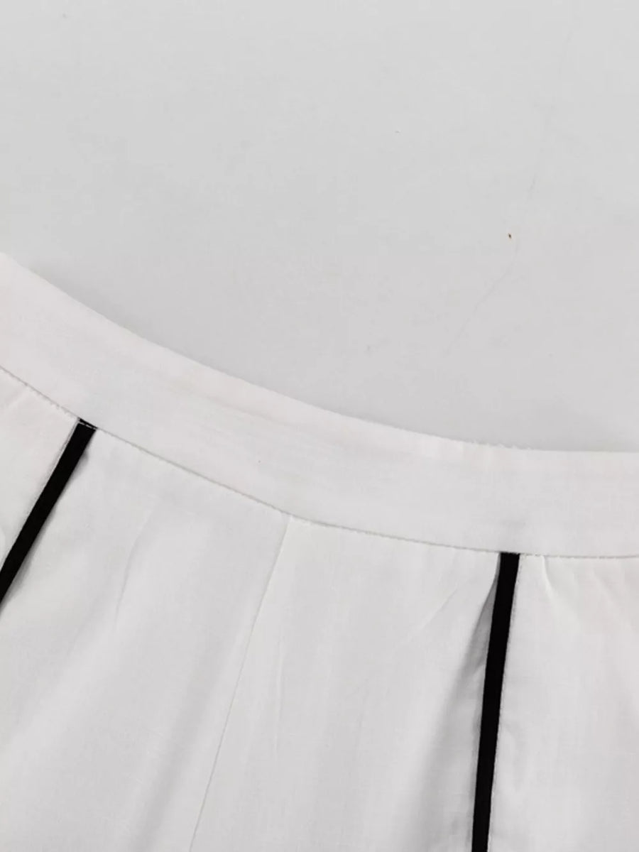 White wide-leg pants with black piping detail