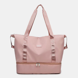 Dusty Pink dual-compartment travel tote with metallic trim and dual zippers.