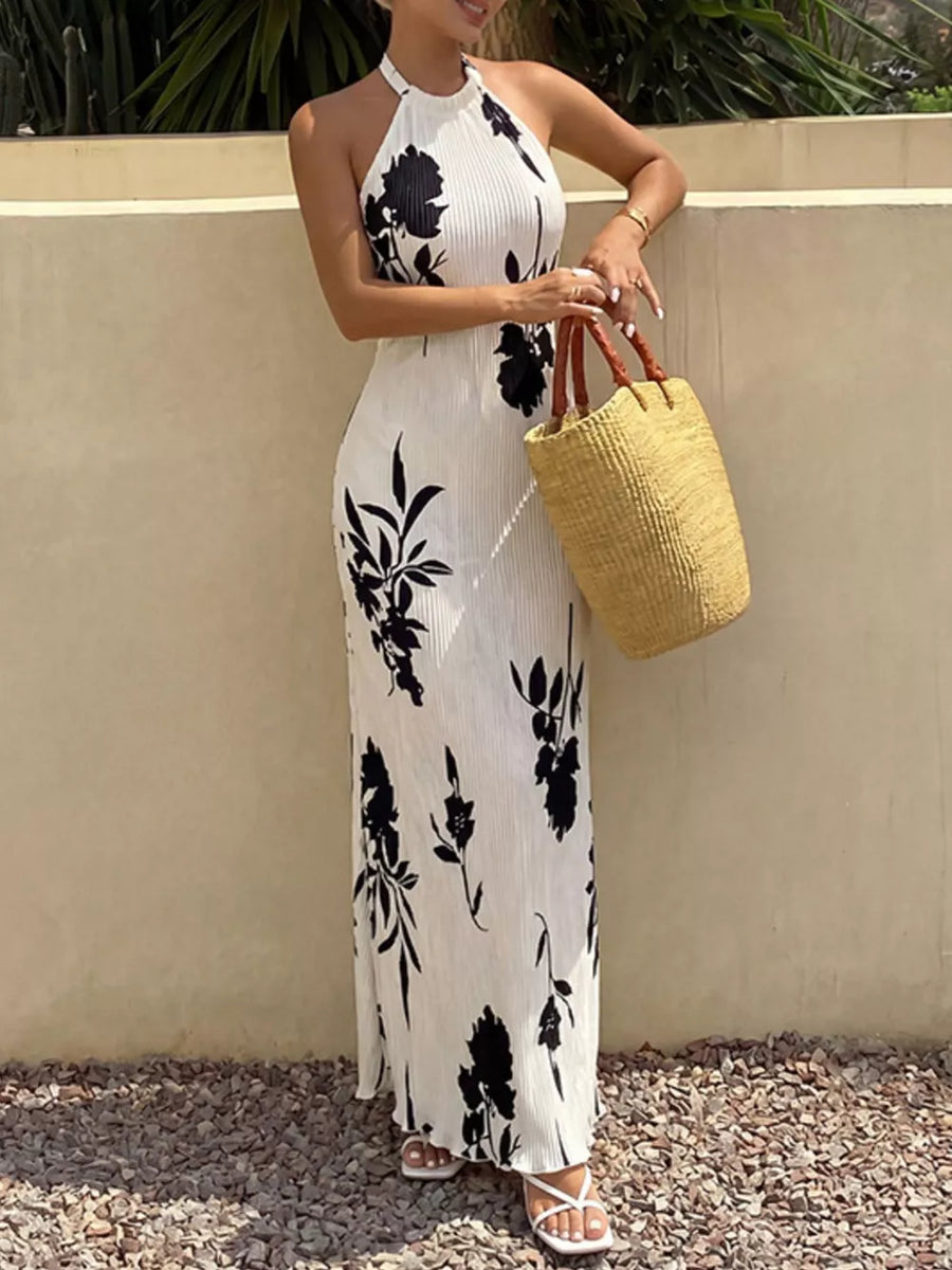Button-down halter maxi dress in ivory with black floral print, a-line cut.