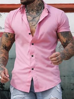 Men's pink slim fit short sleeve button-down shirt with black buttons.