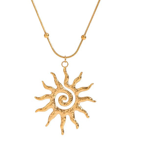 necklace featuring sun motif in gold with lace texture