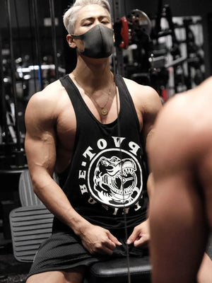 Black graphic muscle tank top with dinosaur print and racerback.