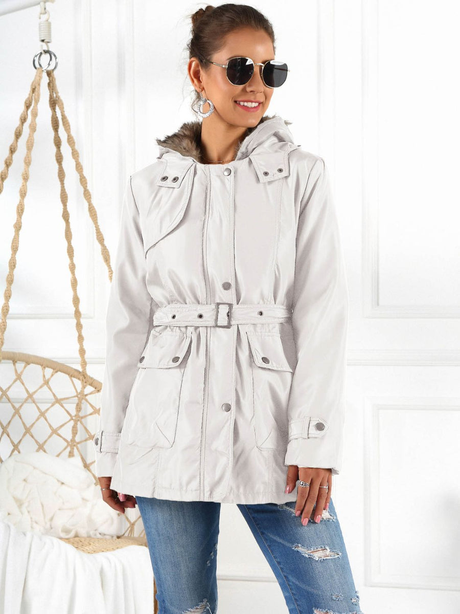 Belted utility parka in white with faux fur hood trim, snap pockets and adjustable waist belt.